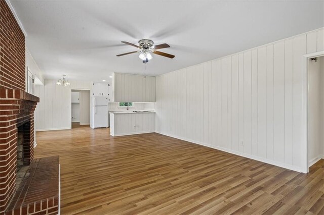 spare room featuring hardwood / wood-style floors and ceiling fan