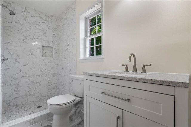 kitchen featuring white appliances, a chandelier, light hardwood / wood-style flooring, sink, and white cabinets