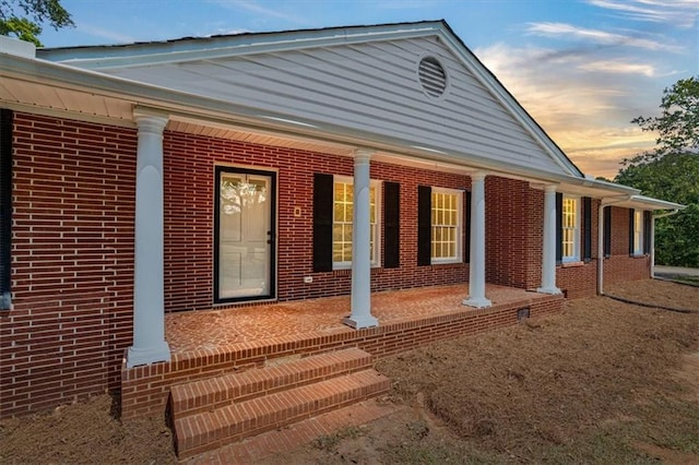 view of front of home with a front lawn and central air condition unit