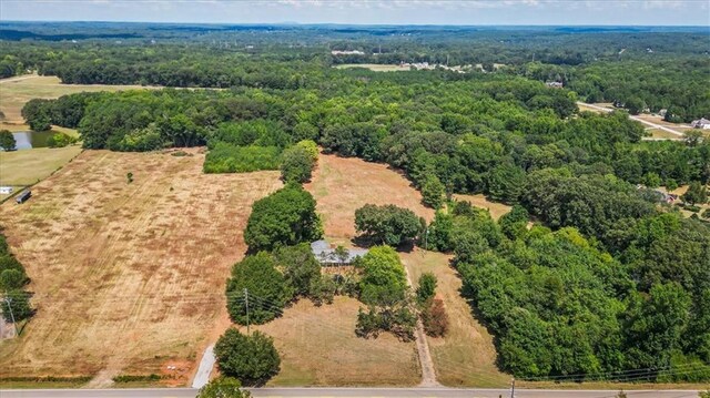 birds eye view of property with a rural view