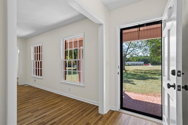 view of side of property featuring central AC unit and a lawn