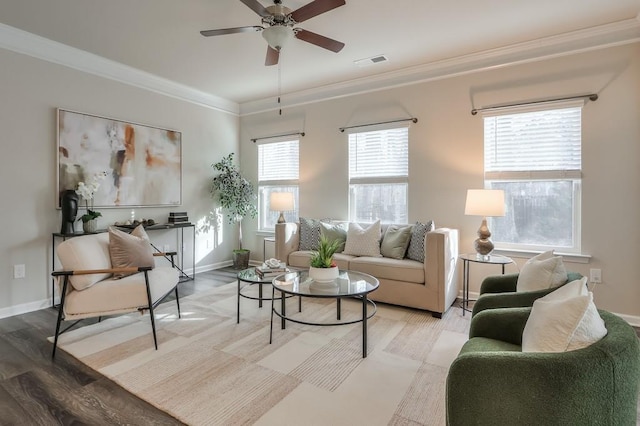 living room featuring crown molding, ceiling fan, and light hardwood / wood-style floors