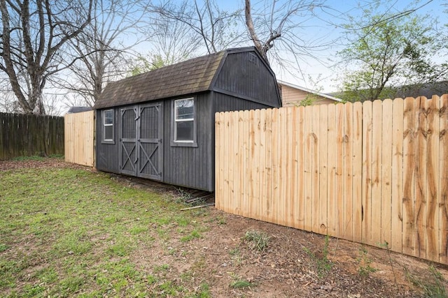 view of shed with fence