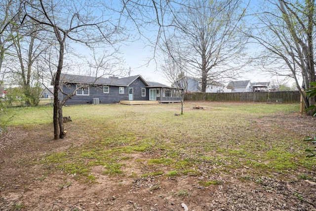 view of yard featuring fence private yard and a deck