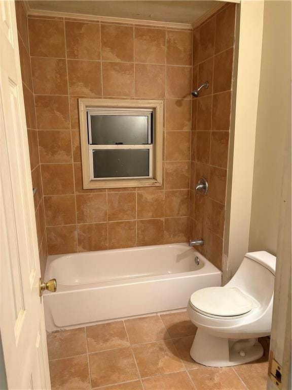 bathroom featuring tile patterned floors, toilet, and shower / bathtub combination