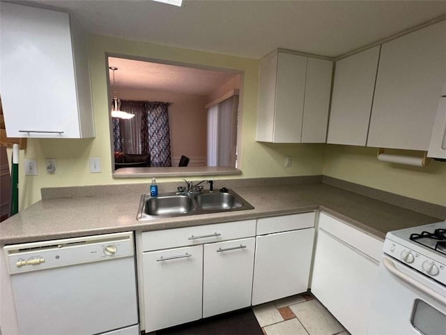 kitchen with white cabinets, sink, and white appliances