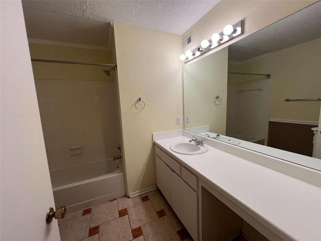 bathroom featuring vanity, a textured ceiling, and shower / bath combination