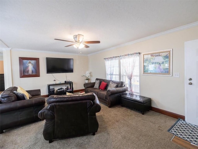 living area featuring carpet floors, crown molding, baseboards, and a ceiling fan