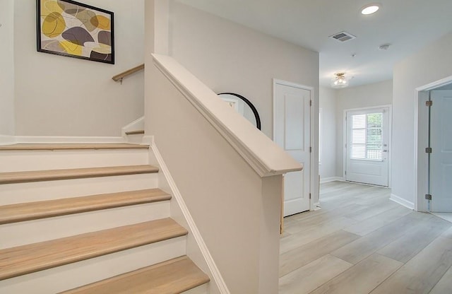 stairs with wood-type flooring