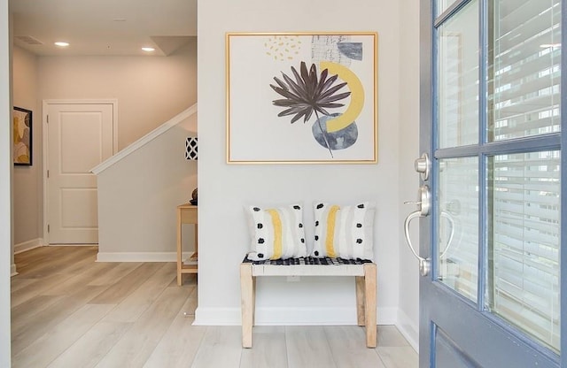 foyer with light hardwood / wood-style floors