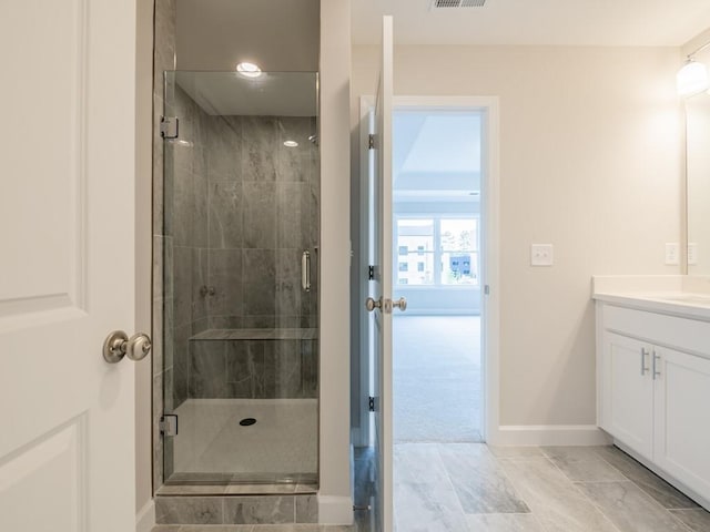 bathroom featuring vanity and walk in shower