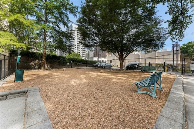 view of community featuring fence
