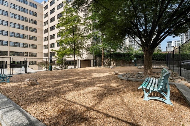 view of community featuring fence
