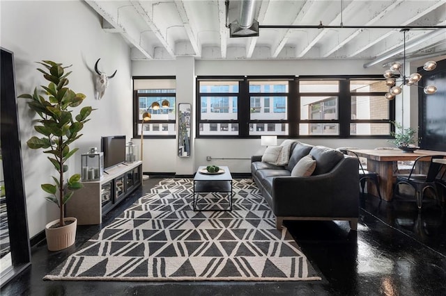 living area featuring plenty of natural light and beam ceiling