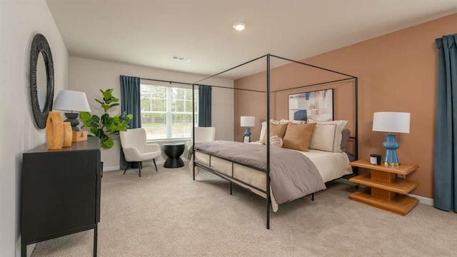 bedroom with light colored carpet