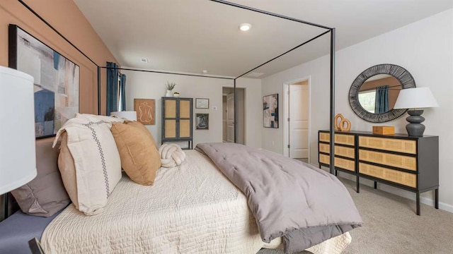 bedroom with carpet floors and baseboards