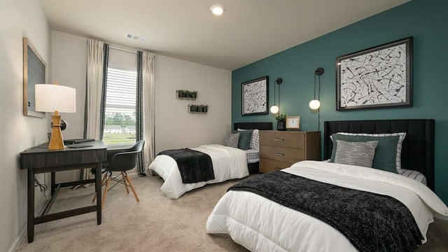 bedroom featuring light carpet