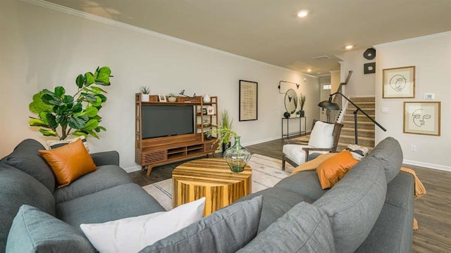 living area featuring baseboards, wood finished floors, stairs, crown molding, and recessed lighting