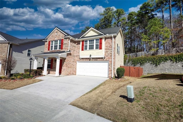 view of front of property with a garage and a front lawn