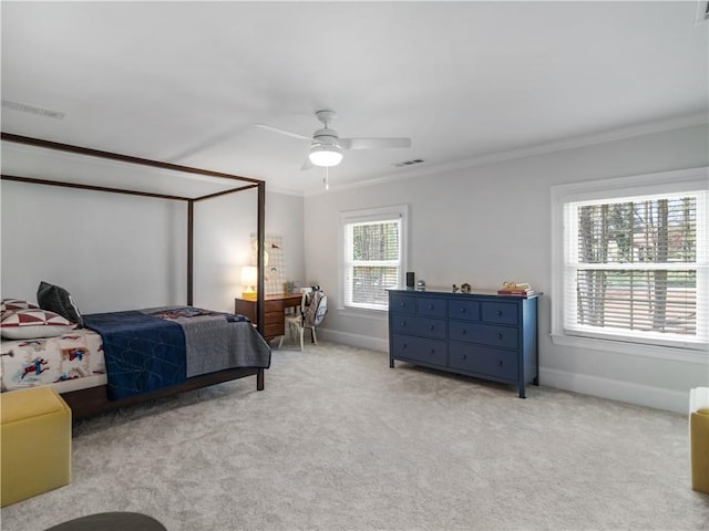 bedroom featuring crown molding, ceiling fan, light carpet, baseboards, and visible vents