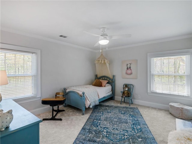 bedroom featuring visible vents, crown molding, baseboards, ceiling fan, and light colored carpet