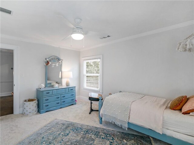 bedroom featuring crown molding, carpet flooring, and visible vents