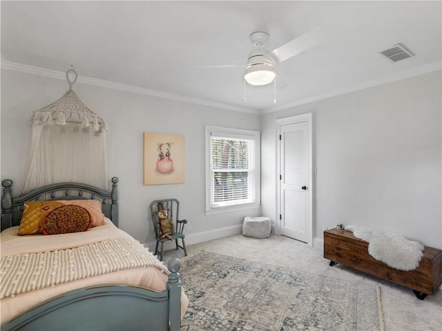 bedroom featuring carpet flooring, a ceiling fan, baseboards, visible vents, and ornamental molding
