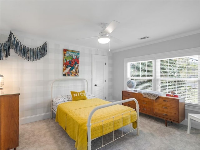 bedroom with light colored carpet, visible vents, ornamental molding, and multiple windows