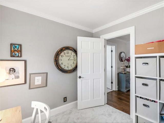 interior space with crown molding, baseboards, and carpet floors