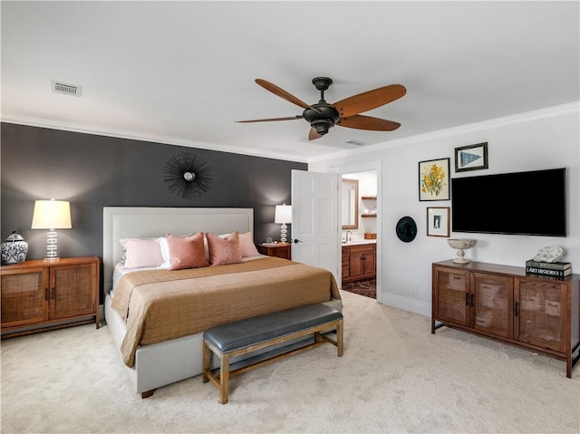bedroom with crown molding, light carpet, ensuite bath, baseboards, and visible vents