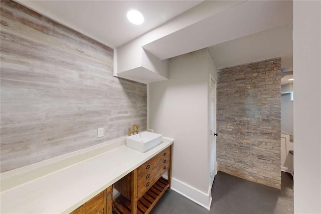 bathroom with finished concrete flooring and vanity