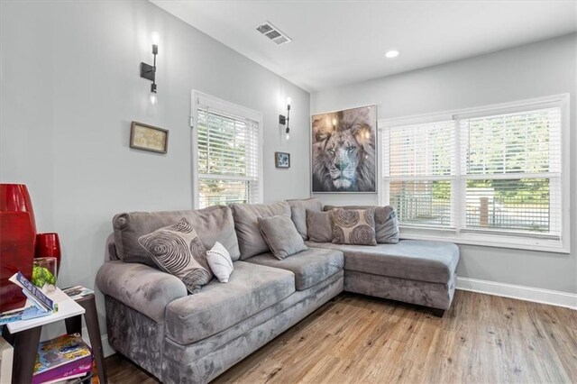 living room with light hardwood / wood-style floors