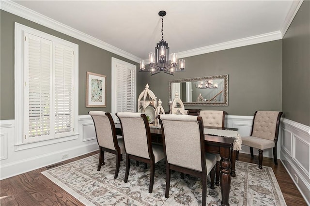176 Nightwind Trce, Acworth, GA 30101 - dining area featuring a chandelier, ornamental molding, dark wood-style floors, a decorative wall, and wainscoting