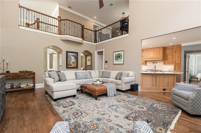 176 Nightwind Trce, Acworth, GA 30101 - living area with arched walkways, ornamental molding, dark wood-type flooring, baseboards, and recessed lighting