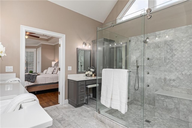 176 Nightwind Trce, Acworth, GA 30101 - ensuite bathroom with a shower stall, vaulted ceiling, vanity, ceiling fan, and ornamental molding
