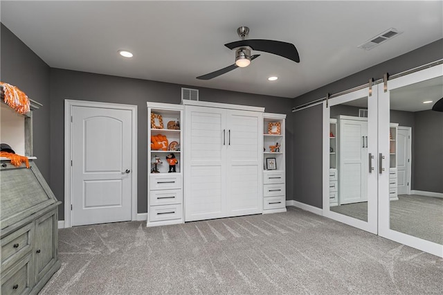 176 Nightwind Trce, Acworth, GA 30101 - unfurnished bedroom with carpet, baseboards, a barn door, recessed lighting, and a ceiling fan