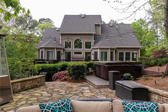 176 Nightwind Trce, Acworth, GA 30101 - rear view of house with a hot tub, a patio area, roof with shingles, and a deck