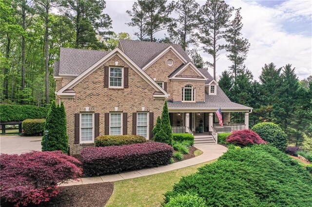 176 Nightwind Trce, Acworth, GA 30101 - view of front of house featuring covered porch, roof with shingles, and brick siding