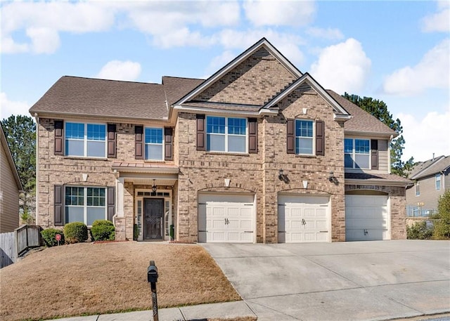 craftsman-style home featuring a garage, driveway, brick siding, and roof with shingles