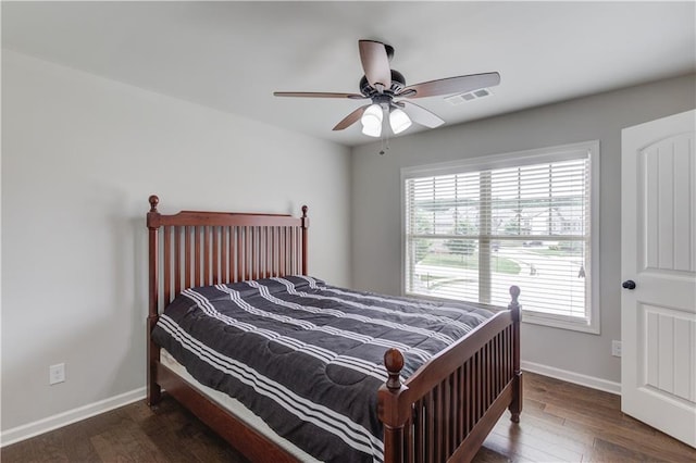 4241 Summer Breeze Way, Buford, GA 30518 - bedroom with multiple windows, baseboards, wood finished floors, and a ceiling fan