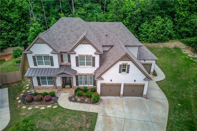 4241 Summer Breeze Way, Buford, GA 30518 - view of front of house with driveway, an attached garage, a standing seam roof, a shingled roof, and stone siding