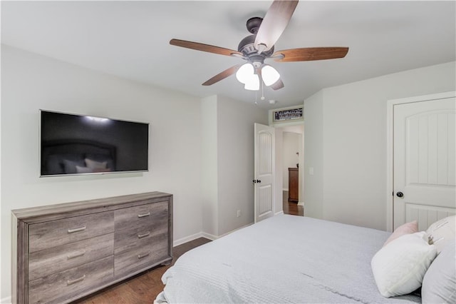 4241 Summer Breeze Way, Buford, GA 30518 - bedroom with dark wood finished floors, baseboards, and a ceiling fan