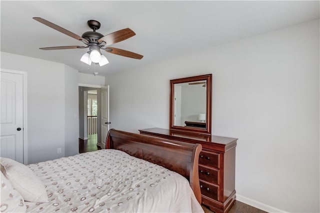 4241 Summer Breeze Way, Buford, GA 30518 - bedroom with dark wood finished floors, baseboards, and ceiling fan