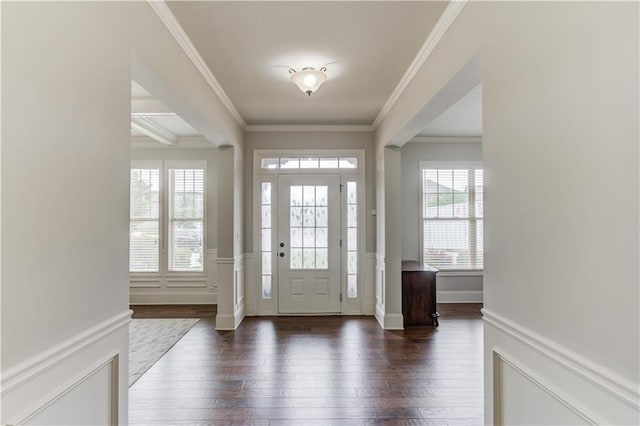 4241 Summer Breeze Way, Buford, GA 30518 - foyer entrance featuring dark wood-style floors, ornamental molding, and a wainscoted wall