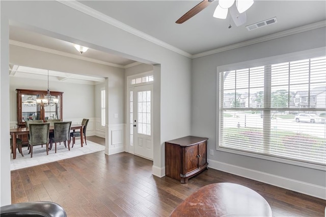4241 Summer Breeze Way, Buford, GA 30518 - foyer entrance with dark wood-type flooring, ceiling fan, a chandelier, wainscoting, and crown molding