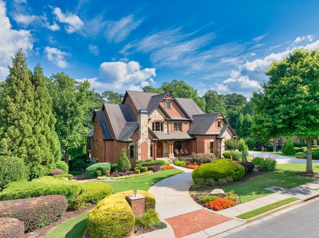 2740 Drayton Hall Dr, Buford, GA 30519 - craftsman-style house with brick siding, a porch, stone siding, and a front lawn