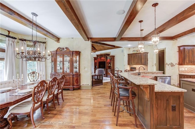 2740 Drayton Hall Dr, Buford, GA 30519 - interior space with light wood-style floors, stainless steel dishwasher, a notable chandelier, and beam ceiling