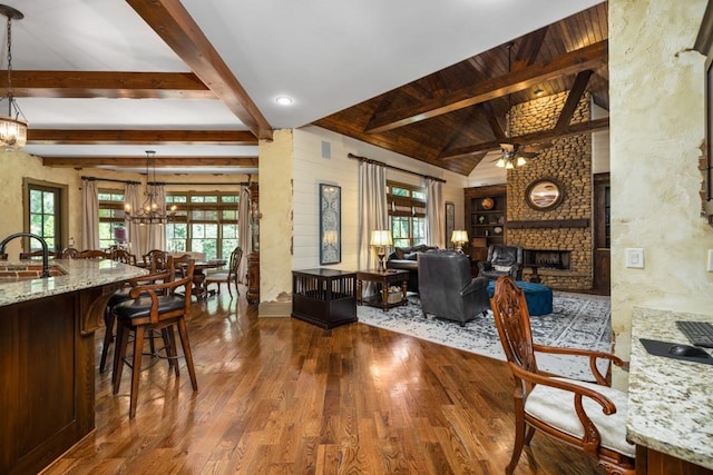 2740 Drayton Hall Dr, Buford, GA 30519 - living area featuring a healthy amount of sunlight, beamed ceiling, and dark wood finished floors