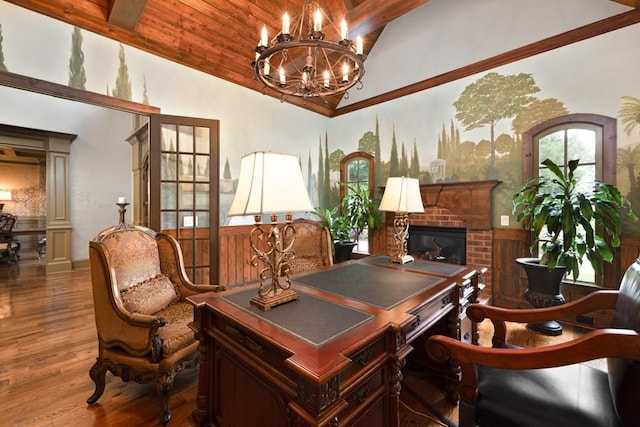 2740 Drayton Hall Dr, Buford, GA 30519 - office space with a brick fireplace, lofted ceiling with beams, a chandelier, wood finished floors, and a wainscoted wall