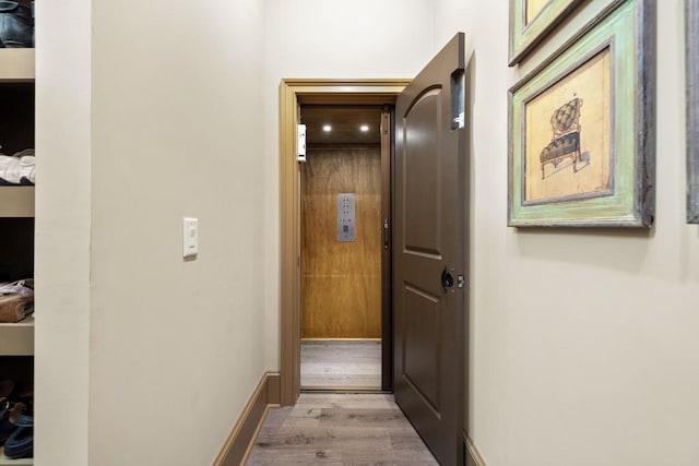 2740 Drayton Hall Dr, Buford, GA 30519 - corridor with elevator and wood finished floors
